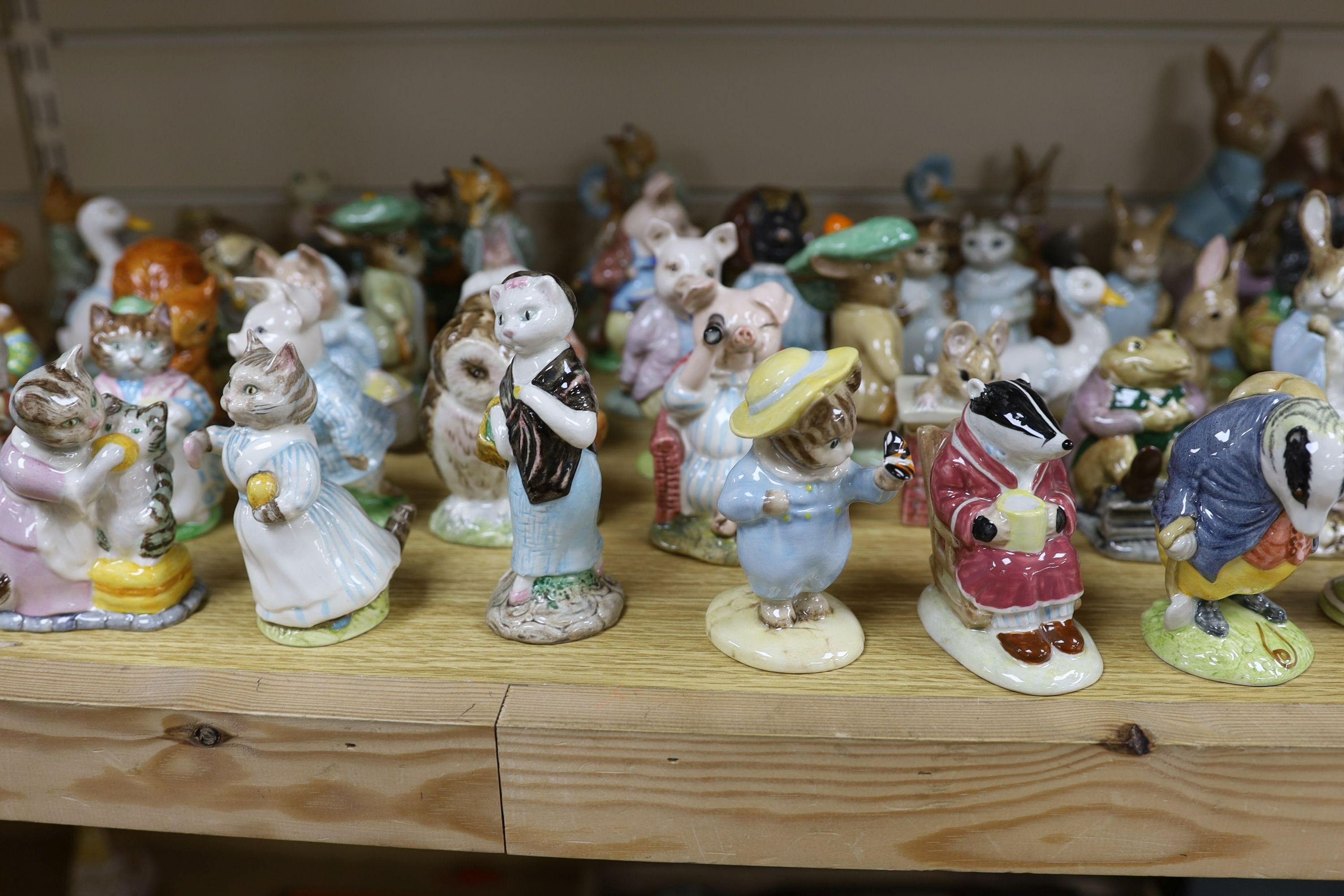 A large collection of Beatrix Potter ceramic figures by Royal Doulton, Beswick and Royal Albert, to include ‘Sir Isaac Newton’ and ‘Mr McGregor’